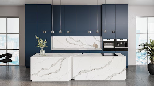 A timeless kitchen features a modern layout with a quartz-wrapped kitchen island and plenty of closed storage.